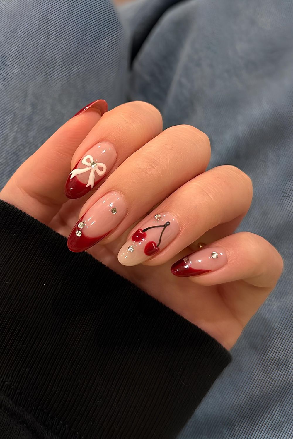 Red mix and match French nails with bows and cherries