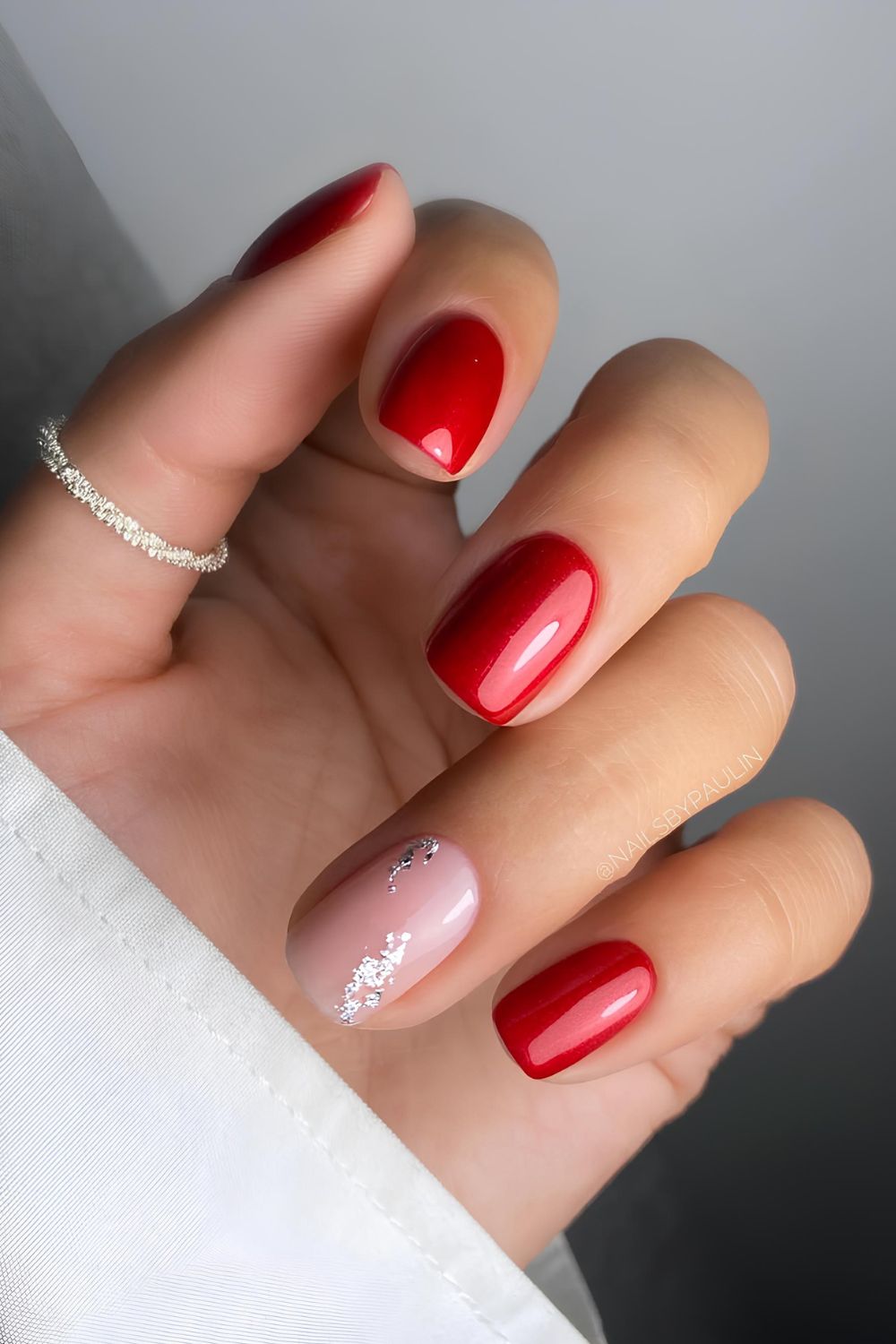 Red nails with silver foil accent