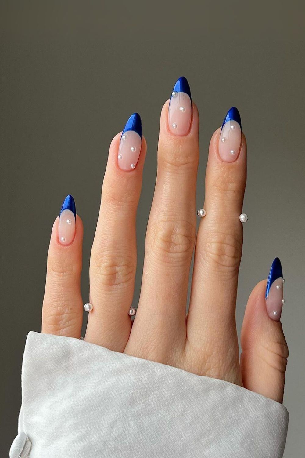 Sapphire blue French tip nails with pearls