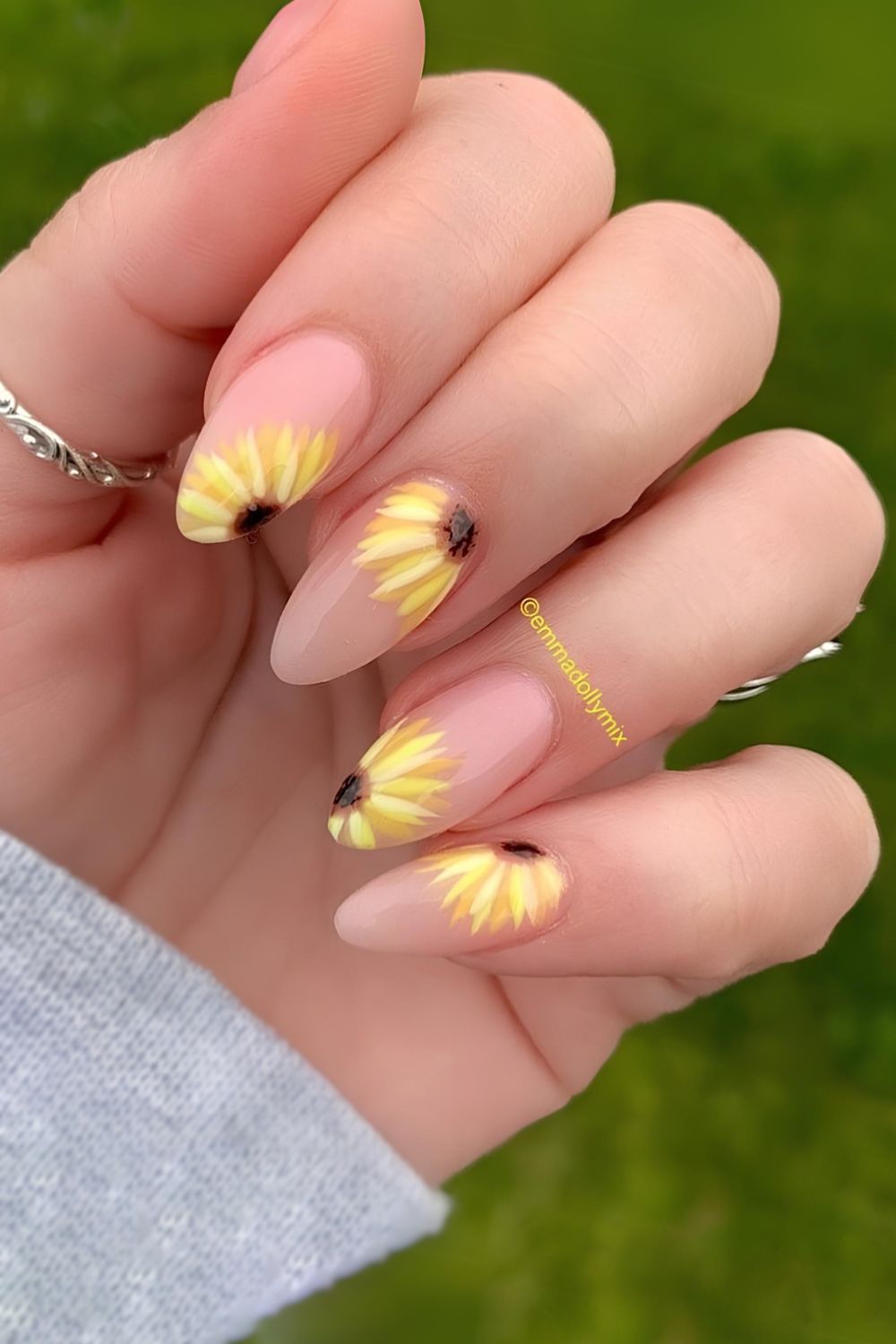 Sheer pink nails with bold sunflower art