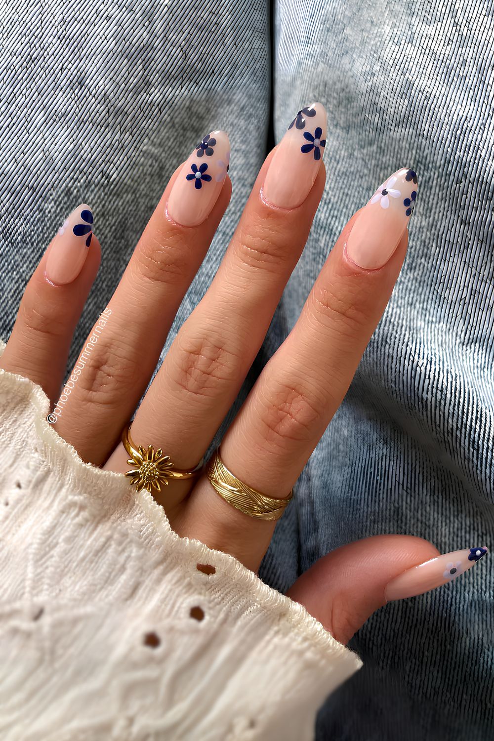 Sheer white mani with navy flowers