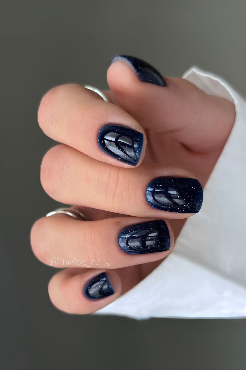 Shimmery dark blue manicure