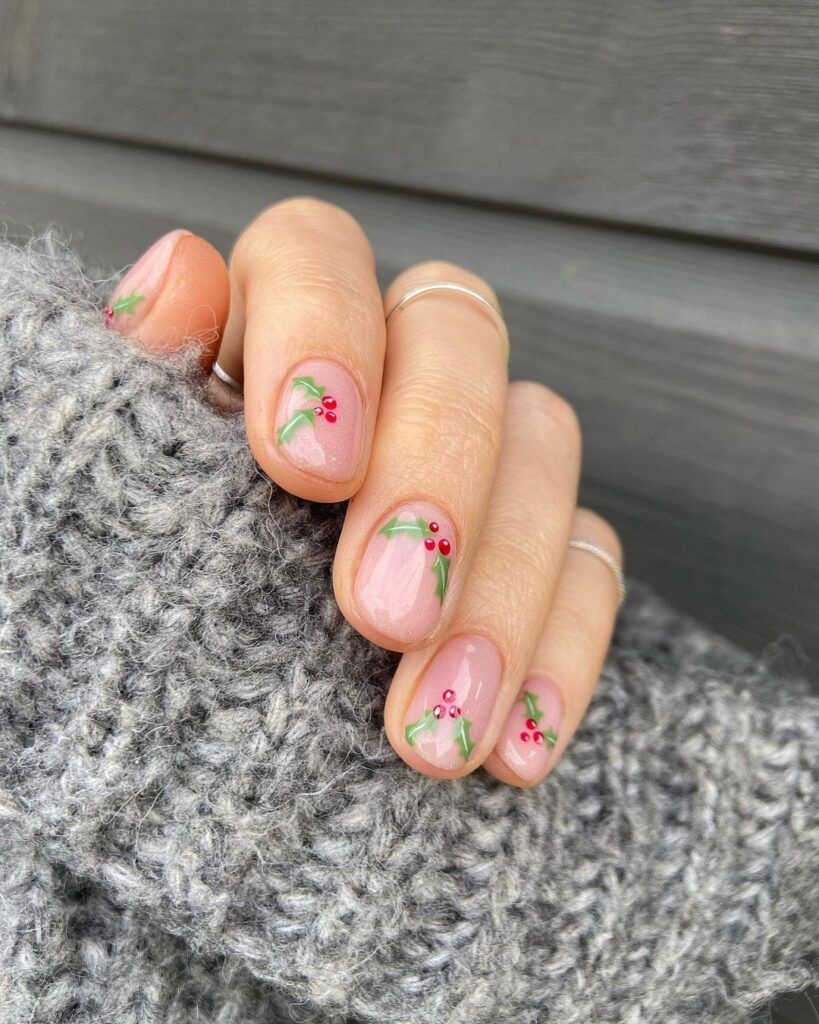 Short nude nails with dainty holly berry accents