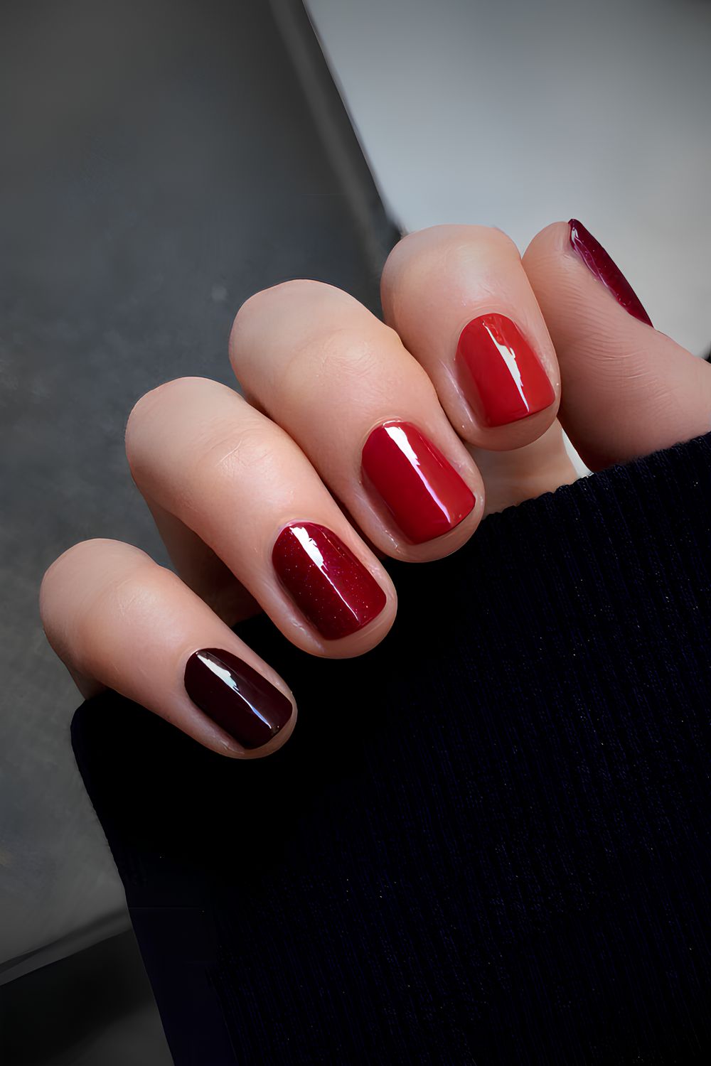 Skittle nails in different shades of red