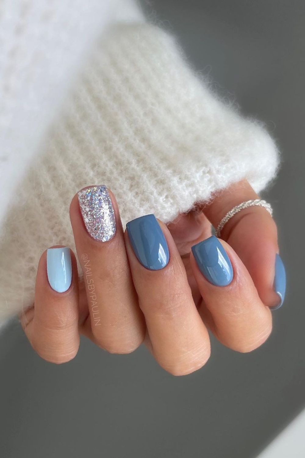 Slate blue mani with silver glitter and light blue accents