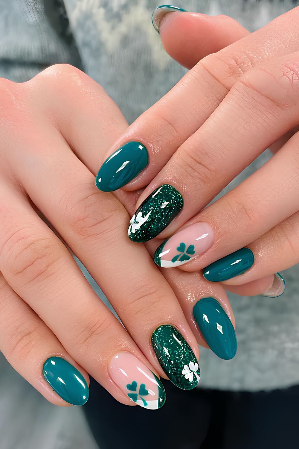 Teal green nails with glitter and shamrock accents