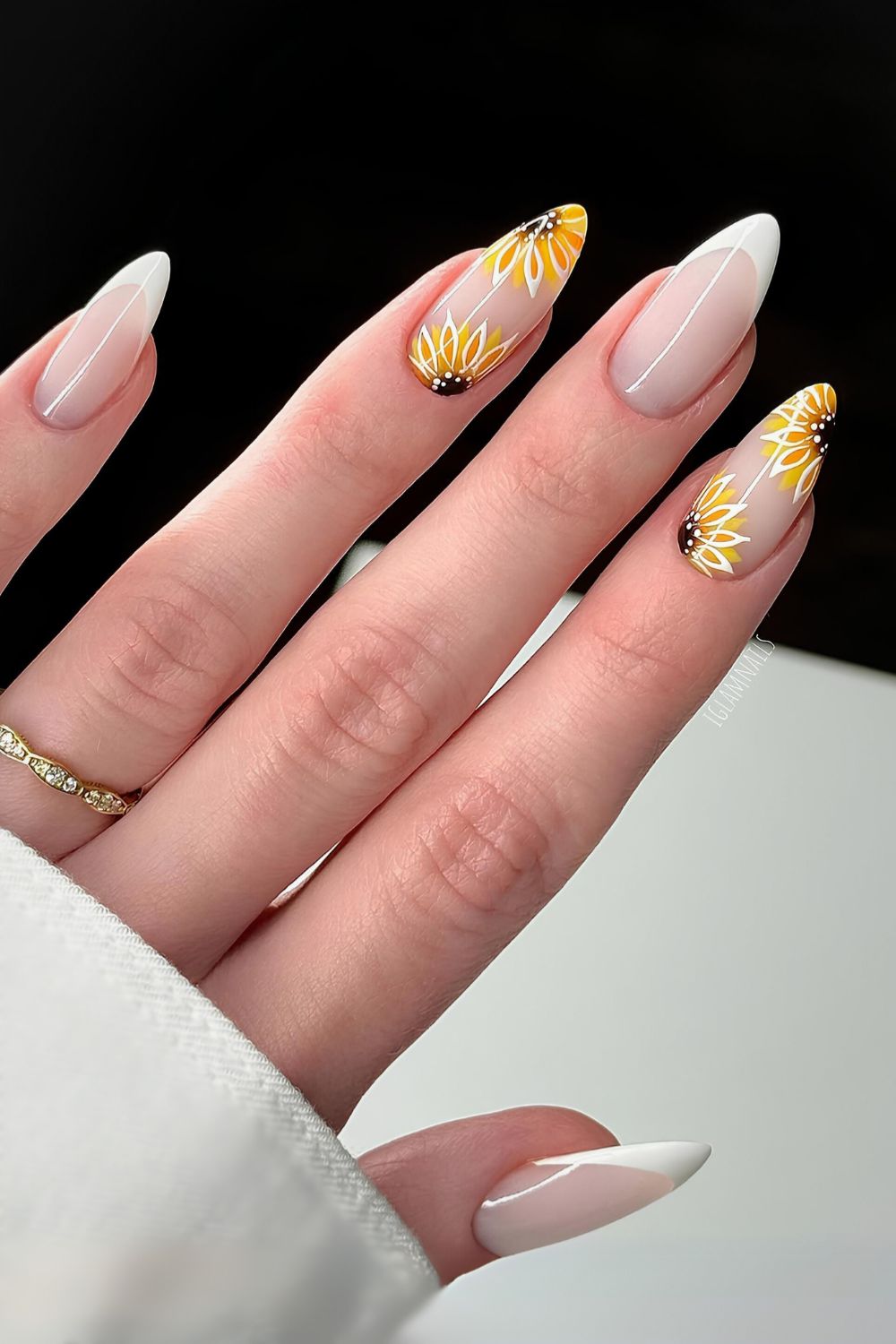 White French mani on a milky base with sunflowers