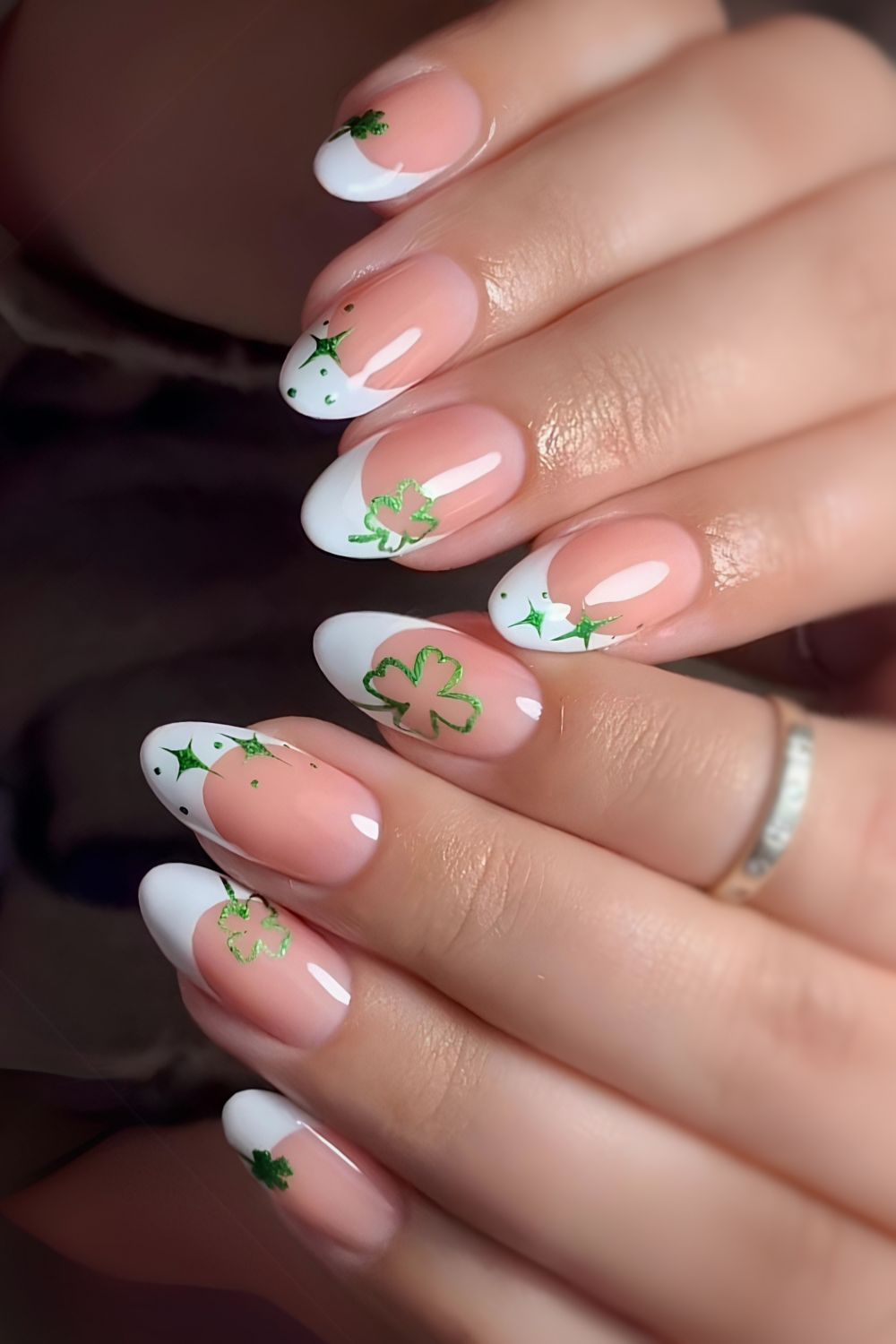 White French nails with clover and star art