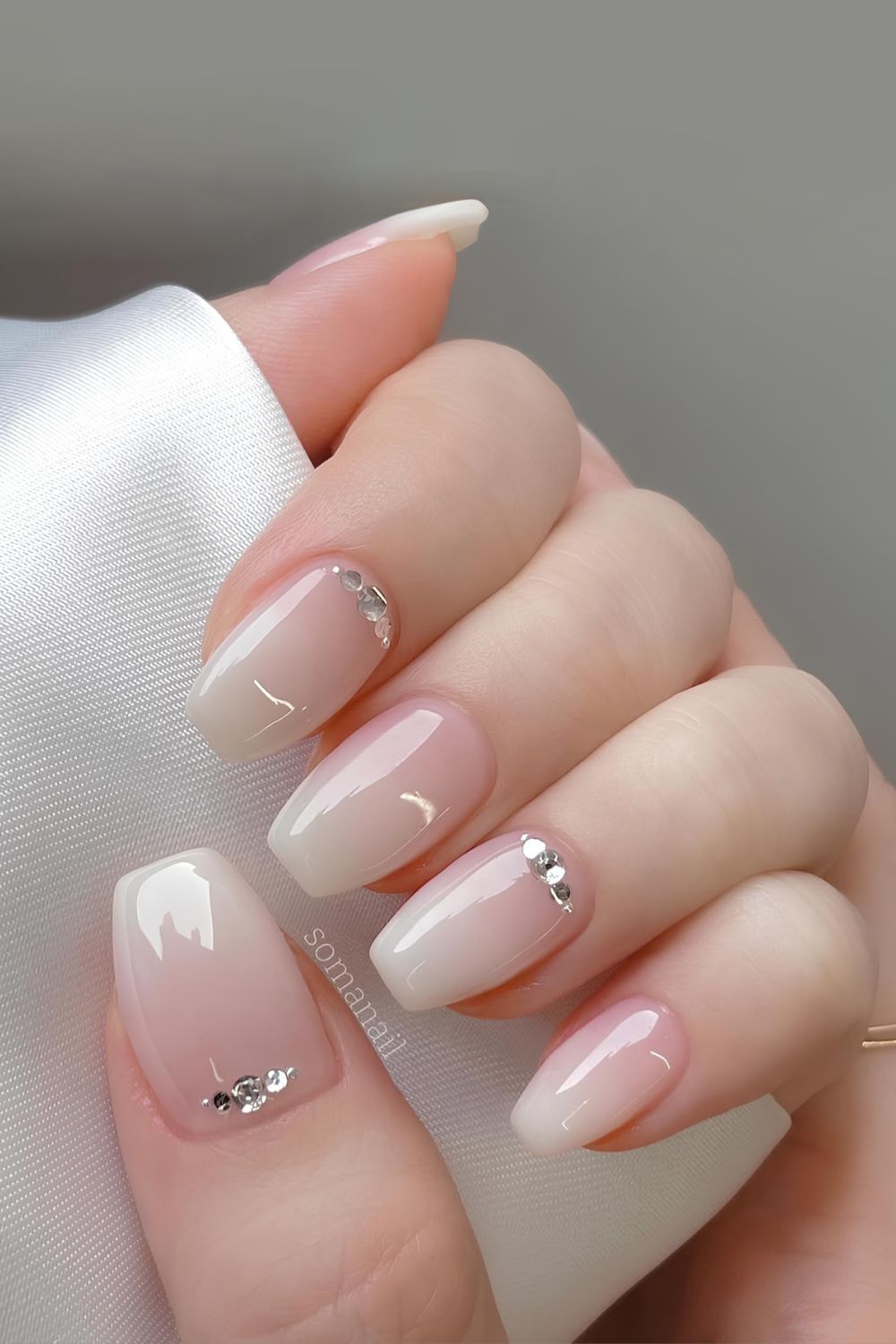 White ombre nails with cuticle rhinestones