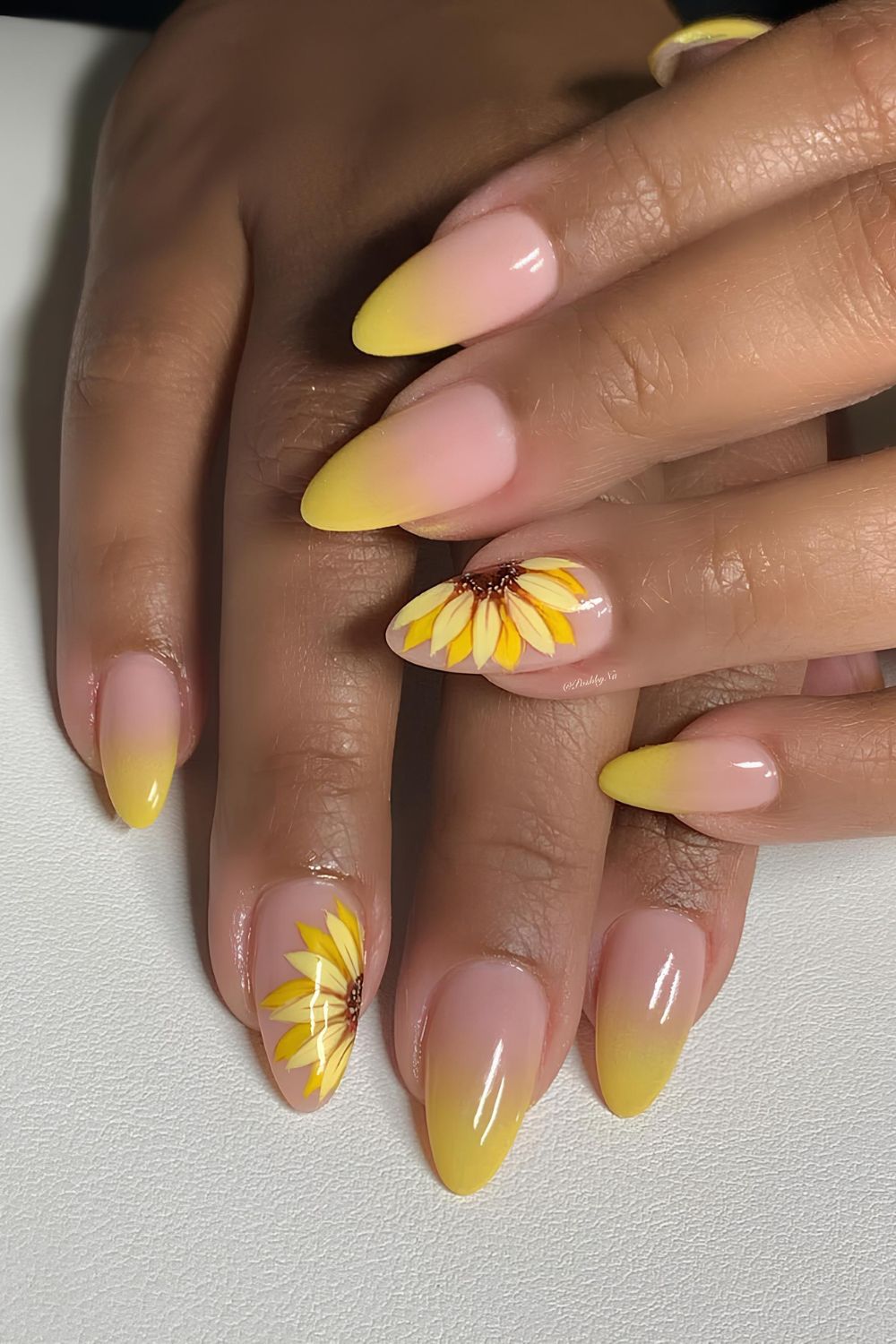 Yellow ombre nails with sunflower accents