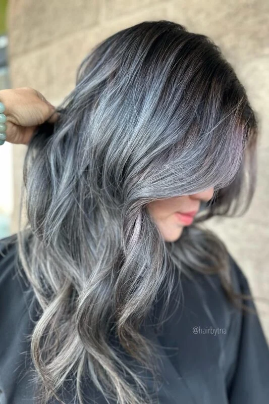 Woman with an ash grey balayage.