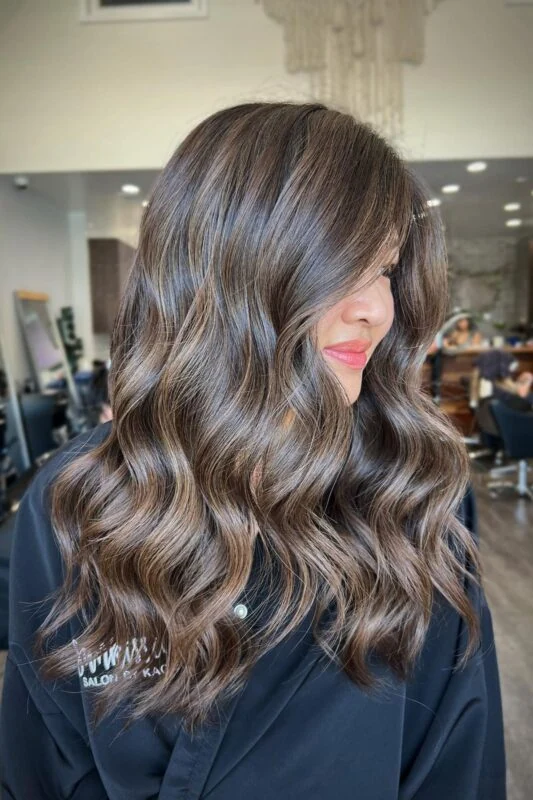 Woman with brunette ash brown hair.