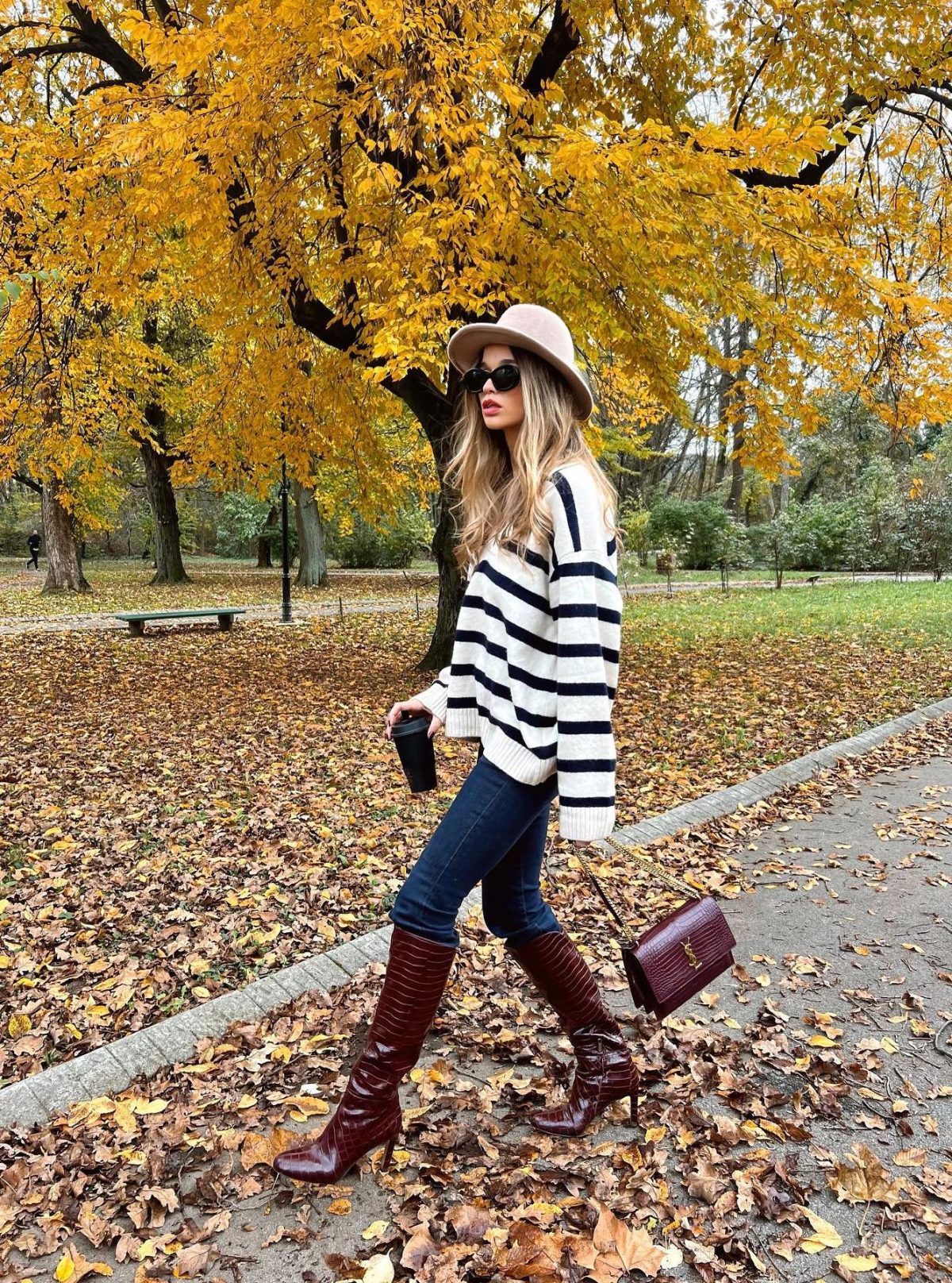 Croc burgundy boots with jeans and a striped sweater