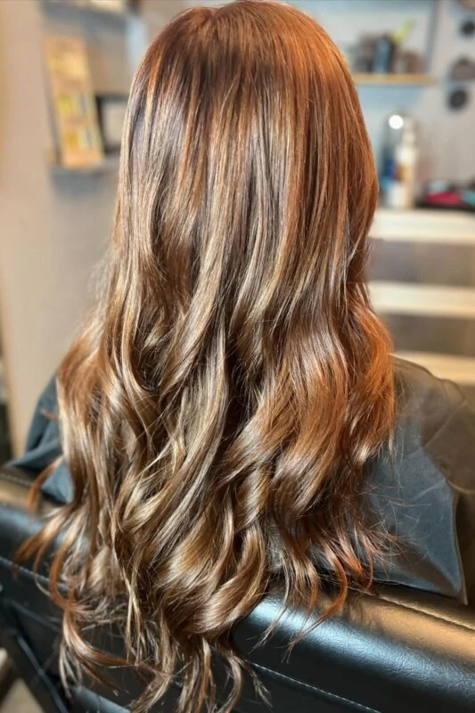 Woman with a butterscotch brown hair color.