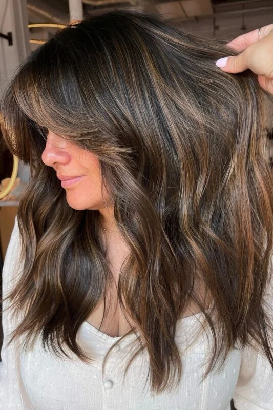 Woman with a caramel balayage.