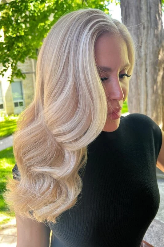 Woman with a champagne blonde hair color.