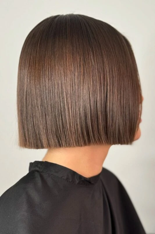 Woman with a chin-length blunt bob haircut.