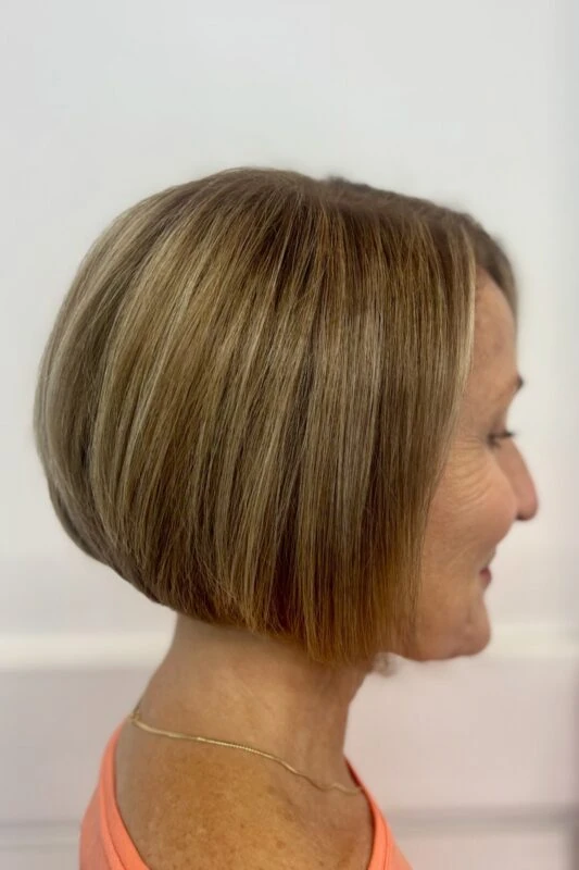 Woman with a chin-length inverted bob haircut.