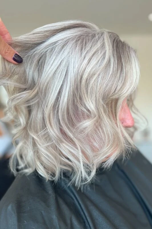 Cool blonde highlights blending gray naturally for blonde hair.