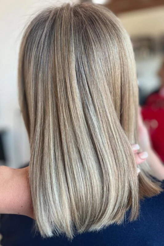 Golden blonde highlights for a warm touch to hide gray on brunettes.