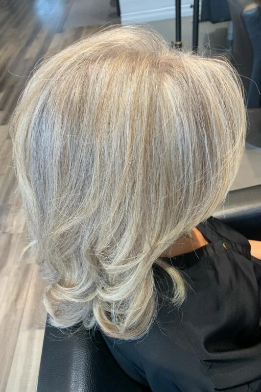 Golden blonde lowlights blending gray beautifully for blondes.