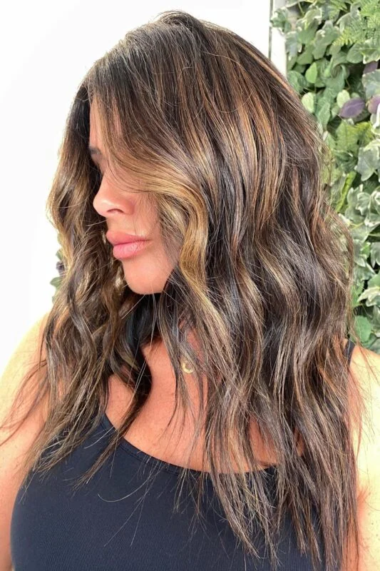 Woman with a golden brown balayage.