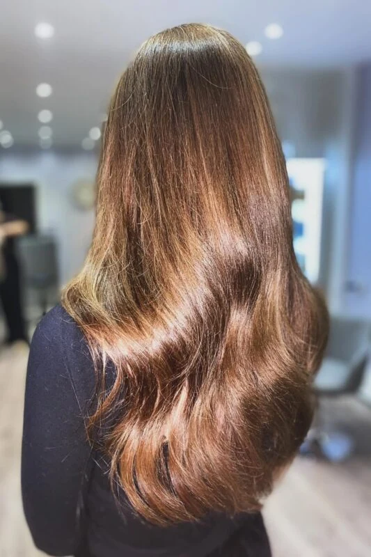 Woman with golden chestnut brown hair.