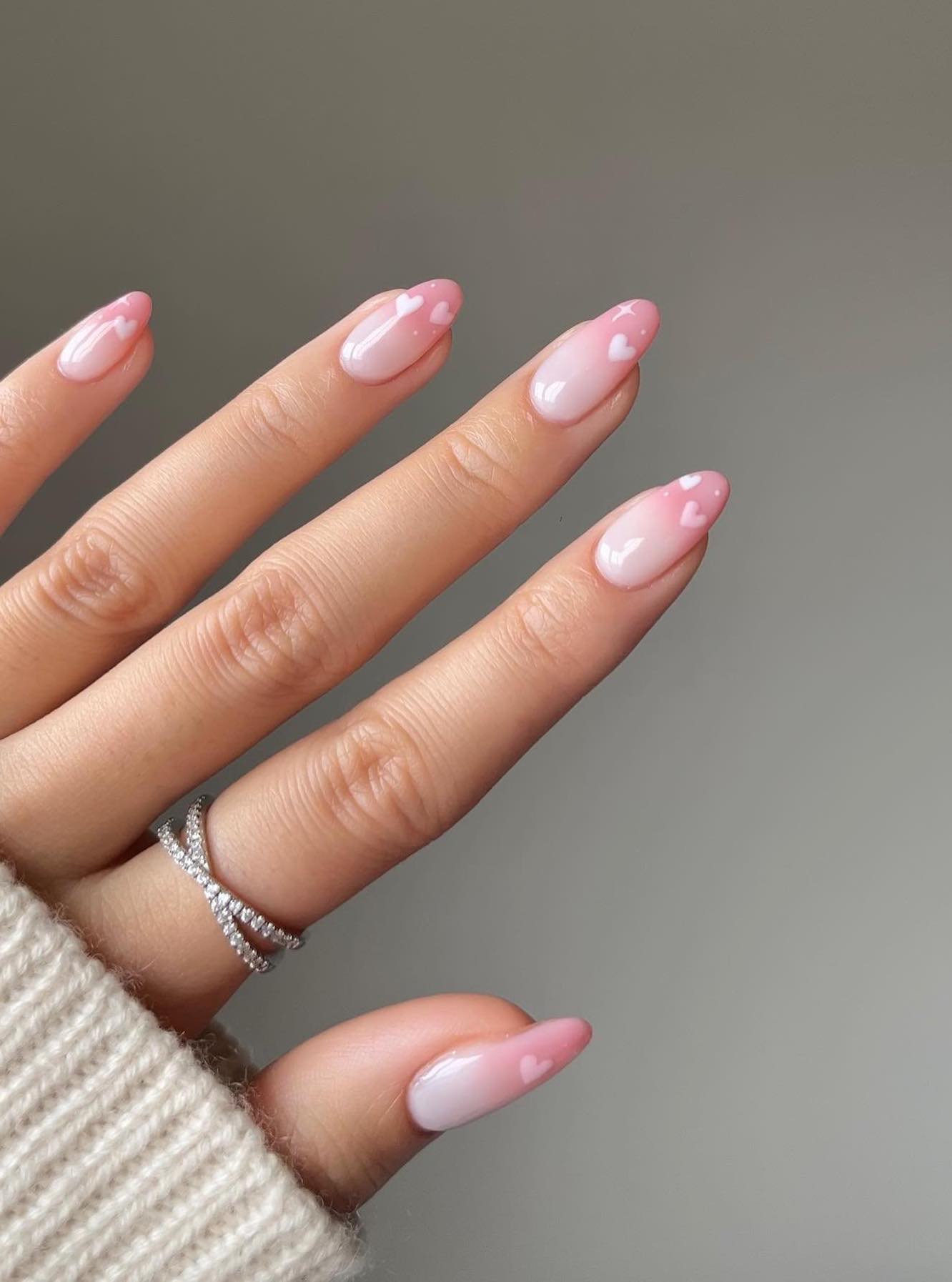 Cute pink ombre nails with hearts