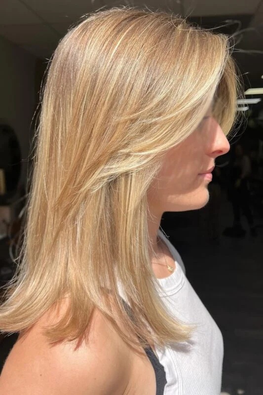 Woman with honey blonde highlights.