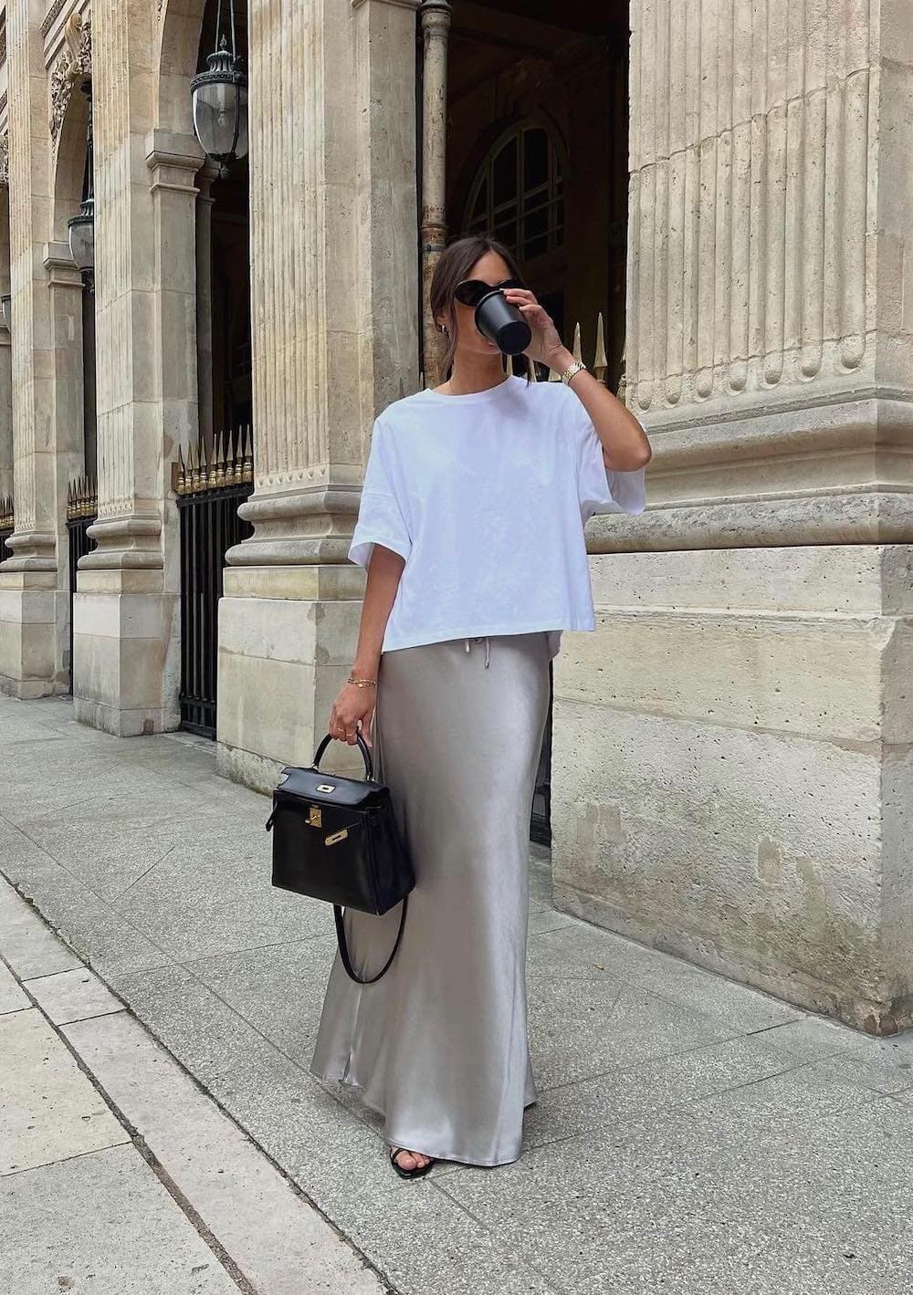 Woman wearing a silk maxi skirt with a t-shirt