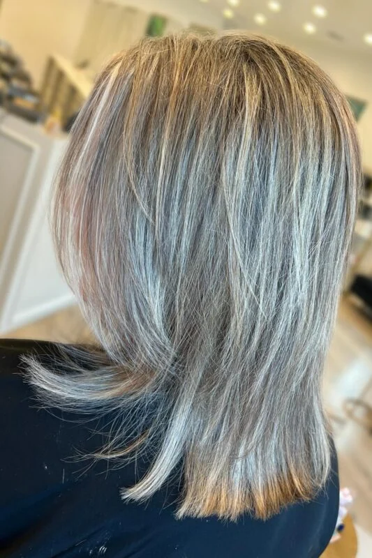 Multitonal blonde highlights effectively covering gray in blonde hair.