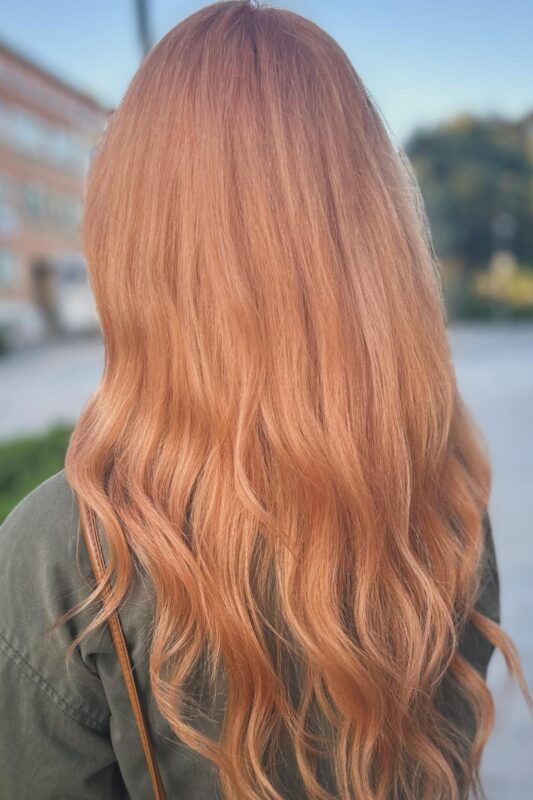 Woman with a peach brown hair color.