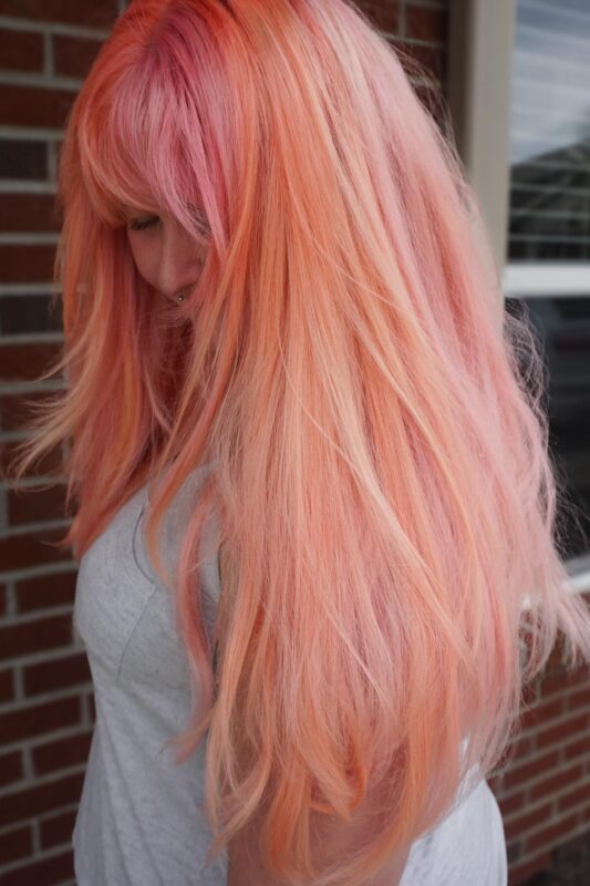 Woman with a peach hair color.