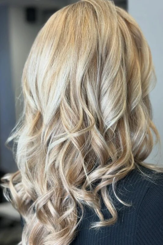 Woman with a pearl blonde hair color.