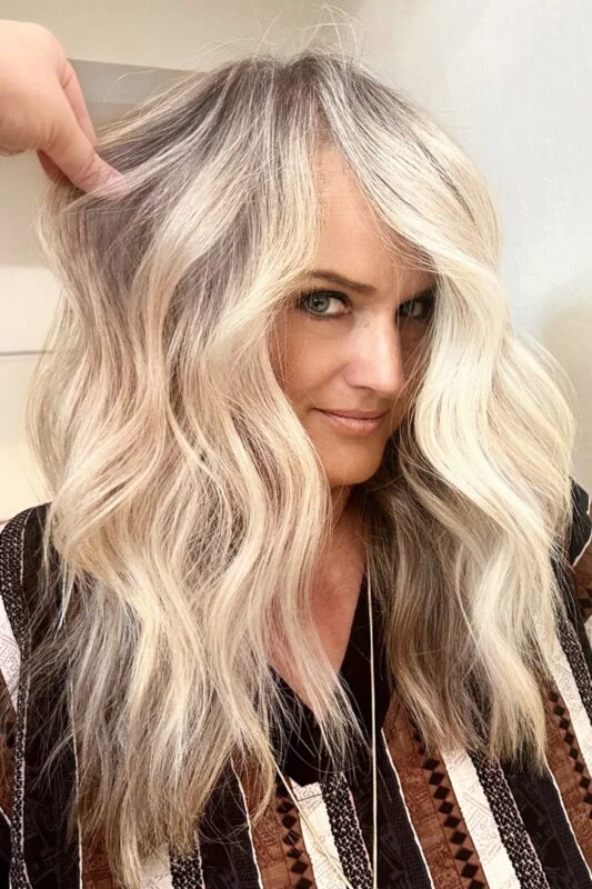 Platinum blonde balayage blending gray hair beautifully for blondes.