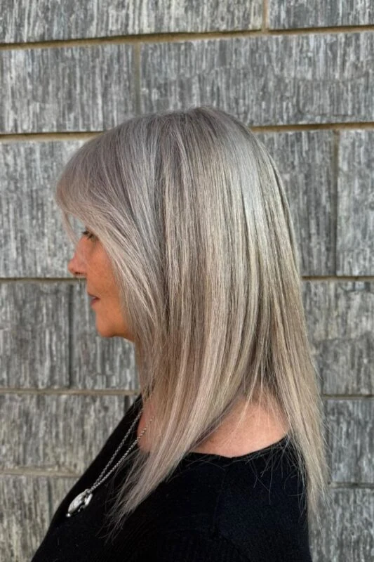 Woman with a salt and pepper hair color.