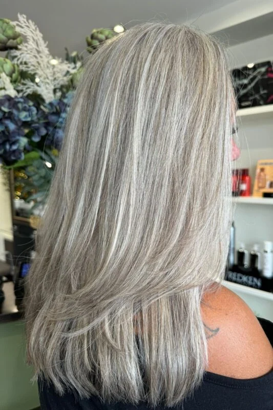 Silver blonde highlights blending gray elegantly for blondes.