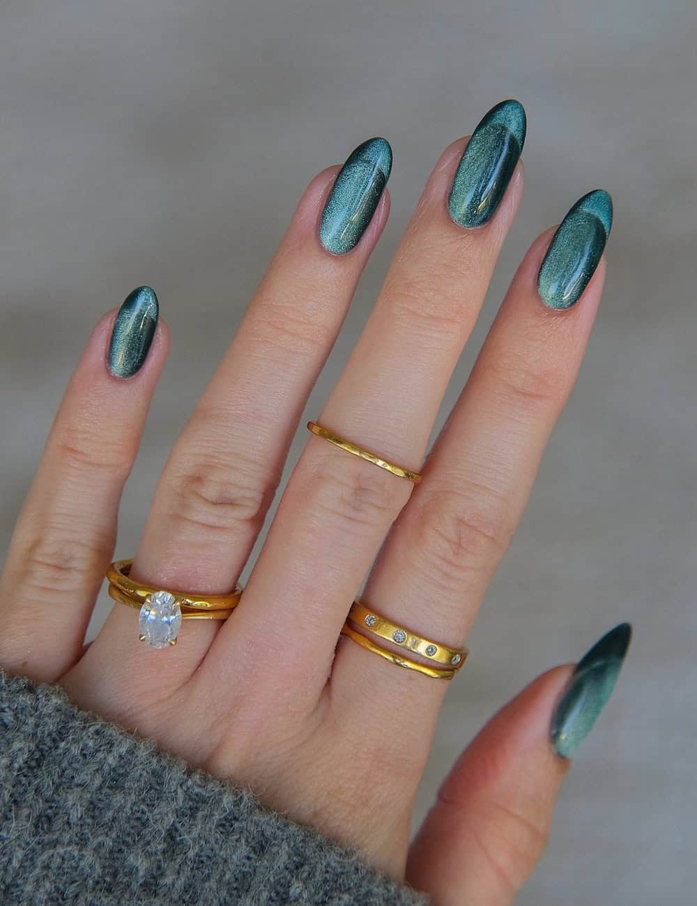 long round nails with teal cat eye frenchies