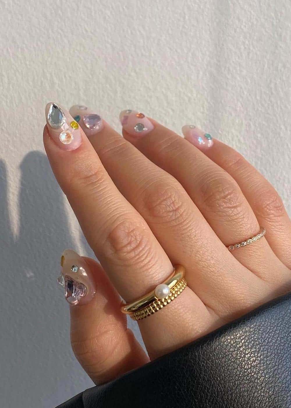 short almond nails with colorful gems