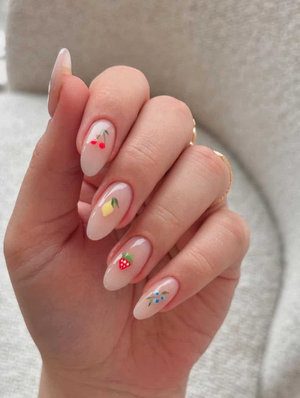 almond nude nails with spring fruit nail art