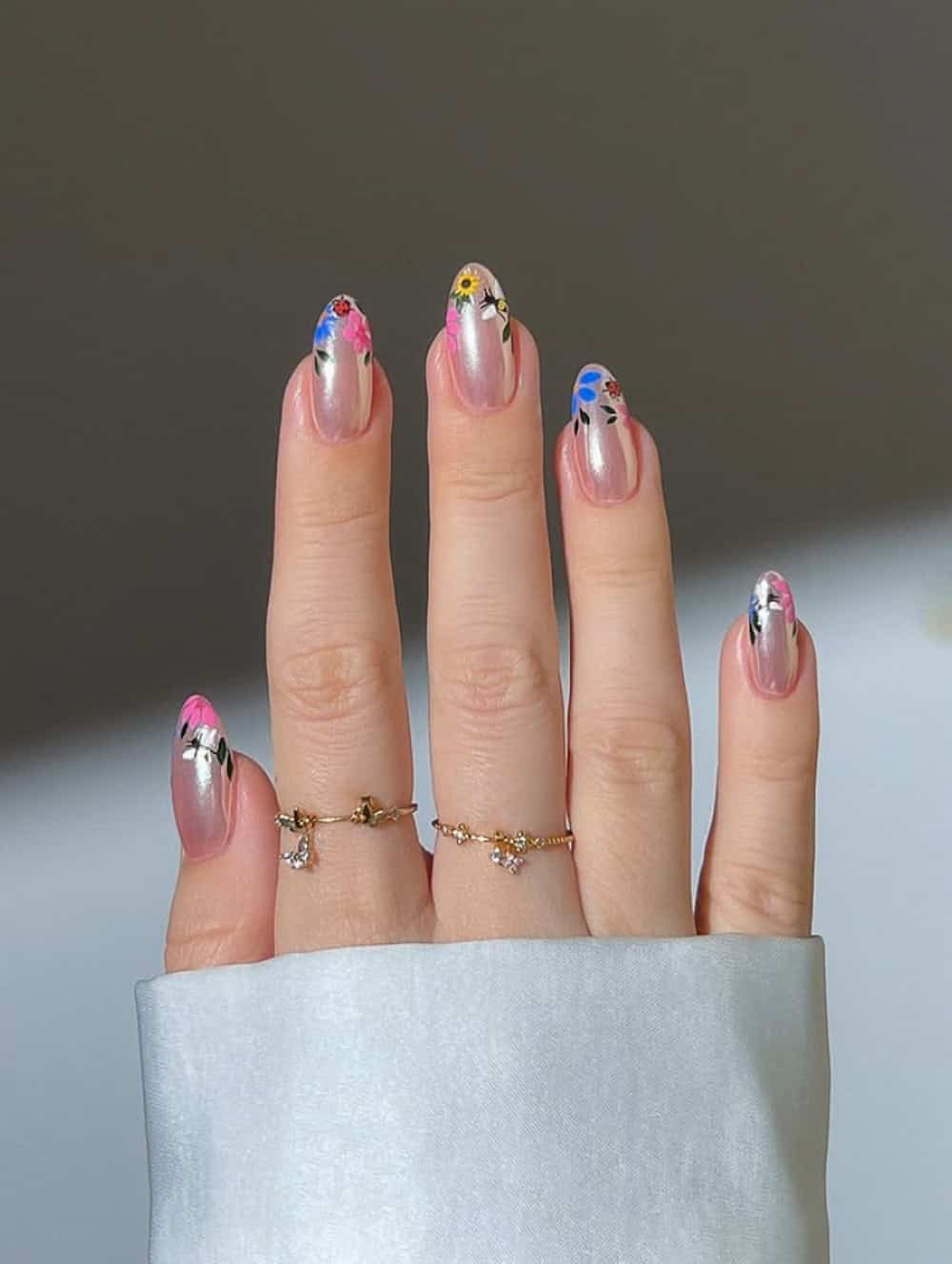 short metallic pink nails with floral tips