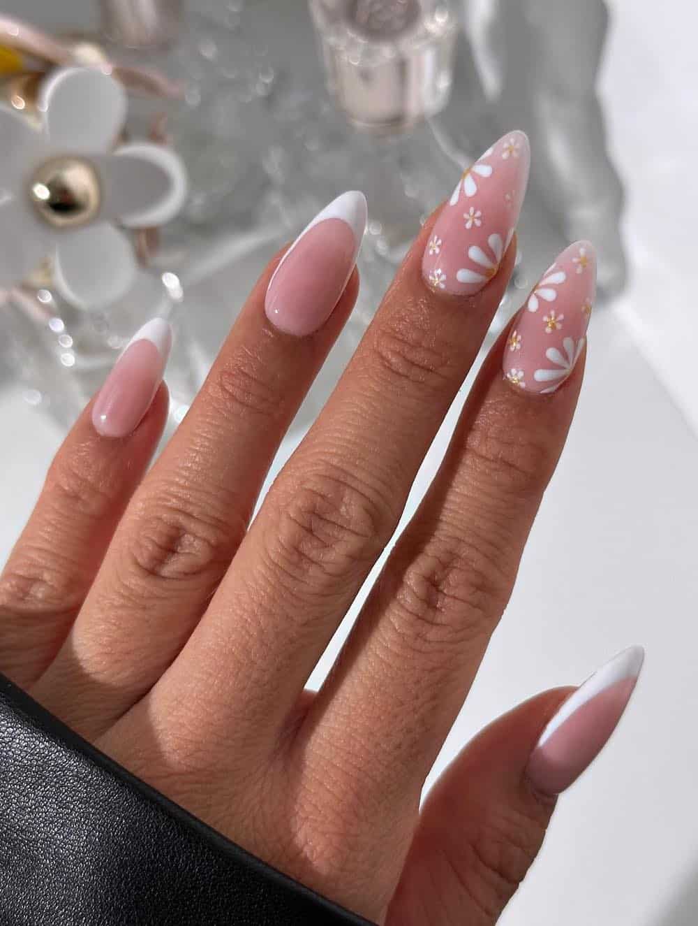 long nude pink nails with white tips and floral accent nails