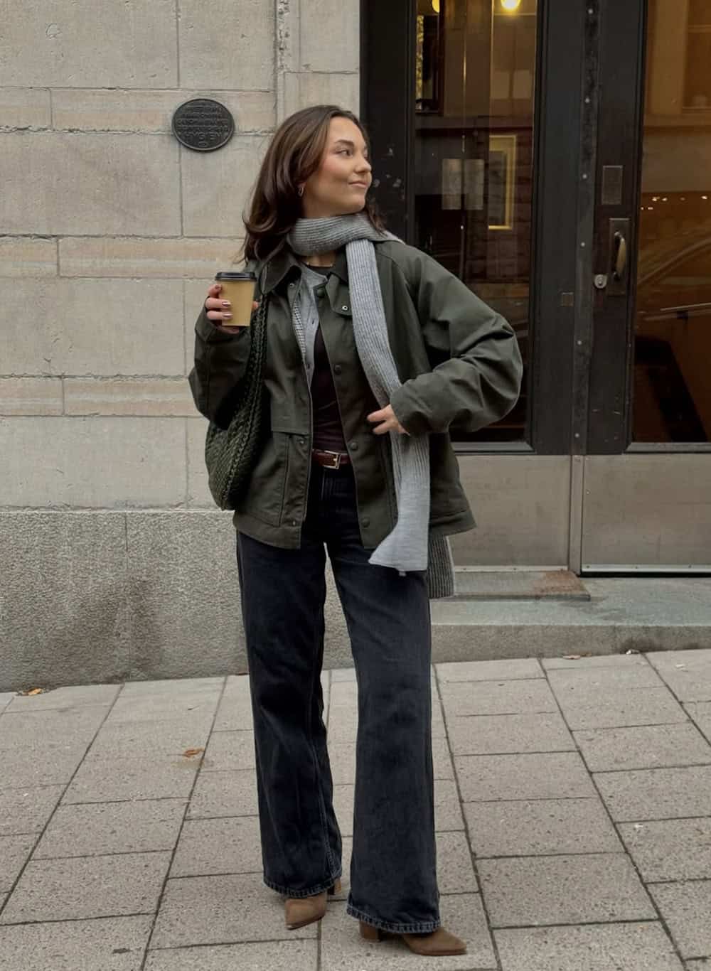 Woman wearing black jeans and a cargo jacket.