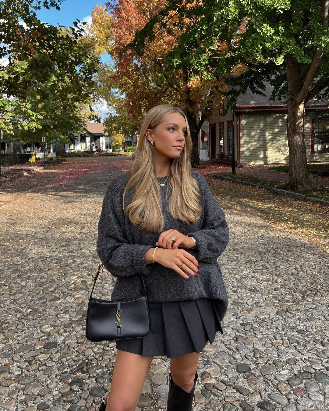 Chic Thanksgiving outfit with grey sweater and pleated mini skirt