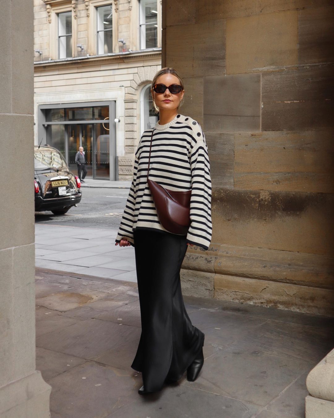 Casual Thanksgiving outfit with striped sweater and black silk skirt