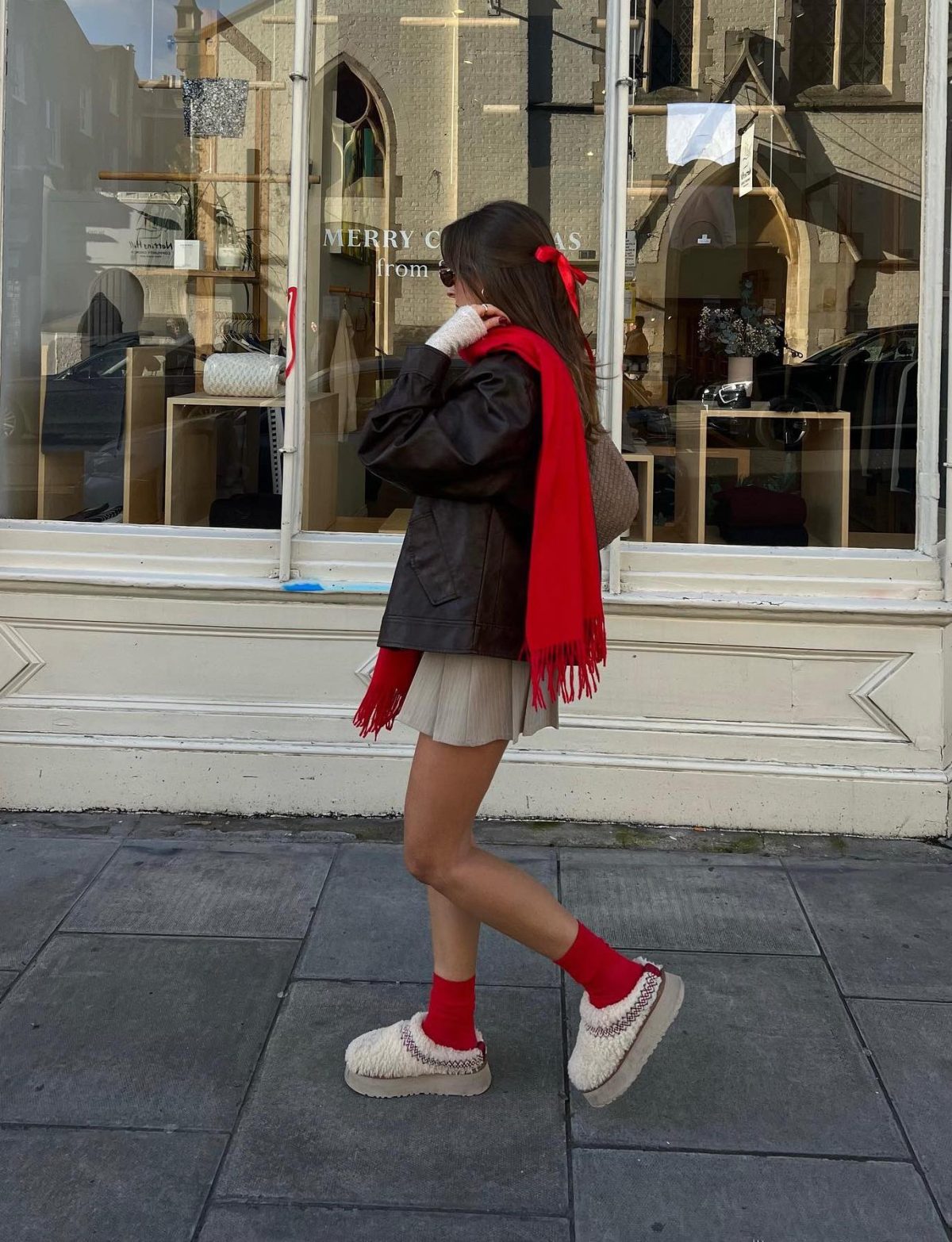 Casual winter outfit with red accessories and Ugg Tasman slippers