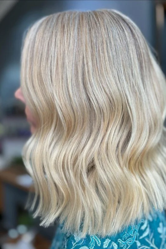 Warm blonde highlights effectively covering gray on blonde hair.